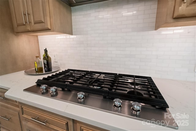 14515 Nolen Ln, Charlotte, NC 28277 - kitchen view of tasteful backsplash and stainless steel gas cooktop