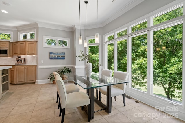 14515 Nolen Ln, Charlotte, NC 28277 - dining area featuring light tile patterned flooring, healthy amount of natural light, ornamental molding, and baseboards