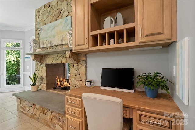 14515 Nolen Ln, Charlotte, NC 28277 - office with built in study area, light tile patterned flooring, crown molding, and a stone fireplace