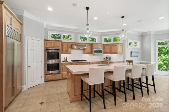 14515 Nolen Ln, Charlotte, NC 28277 - kitchen with built in appliances, a sink, wall chimney range hood, light countertops, and light tile patterned flooring