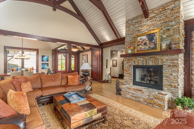 2461 Eagles Nest Rd, Waynesville, NC 28786 - living area with wood finished floors, a fireplace, a chandelier, high vaulted ceiling, and wooden ceiling with exposed beams