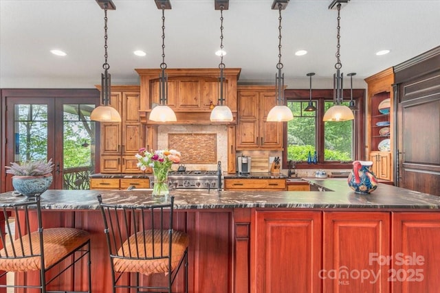 2461 Eagles Nest Rd, Waynesville, NC 28786 - kitchen featuring a large island, recessed lighting, decorative backsplash, a sink, and decorative light fixtures