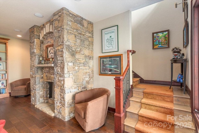2461 Eagles Nest Rd, Waynesville, NC 28786 - stairs with wood-type flooring, baseboards, and a fireplace