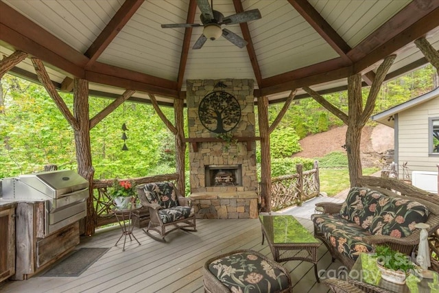 2461 Eagles Nest Rd, Waynesville, NC 28786 - wooden terrace featuring a gazebo, ceiling fan, and an outdoor living space with a fireplace
