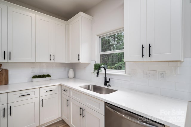 207 9th Ct NE, Conover, NC 28613 - kitchen with a sink, dishwasher, decorative backsplash, and white cabinets
