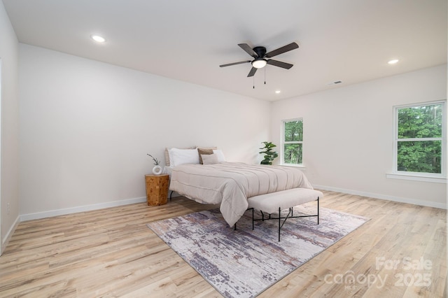 207 9th Ct NE, Conover, NC 28613 - bedroom featuring wood finished floors, multiple windows, baseboards, and recessed lighting