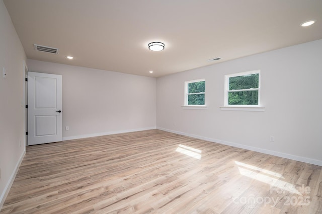 207 9th Ct NE, Conover, NC 28613 - unfurnished room featuring light wood-style floors, baseboards, and recessed lighting