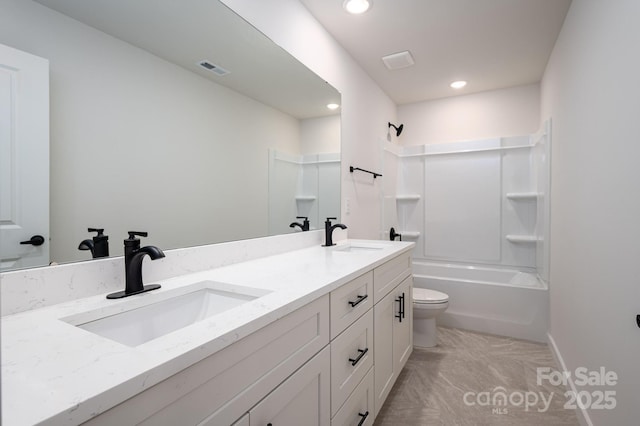 207 9th Ct NE, Conover, NC 28613 - bathroom with double vanity, toilet,  shower combination, recessed lighting, and baseboards