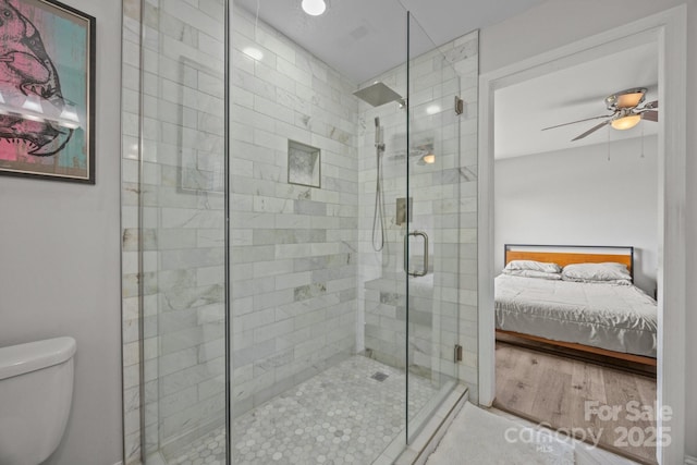 5371 Davidson Rd, Davidson, NC 28036 - ensuite bathroom with a stall shower, toilet, and ceiling fan