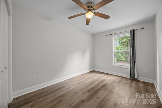 5371 Davidson Rd, Davidson, NC 28036 - unfurnished room with wood finished floors, baseboards, and ceiling fan