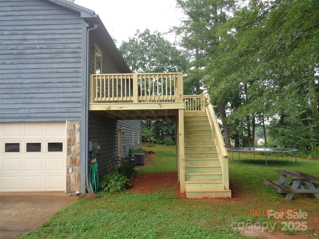 1203 Dudley Shoals Rd, Granite Falls, NC 28630 - view of home's exterior with a trampoline, stairs, a wooden deck, stone siding, and central air condition unit
