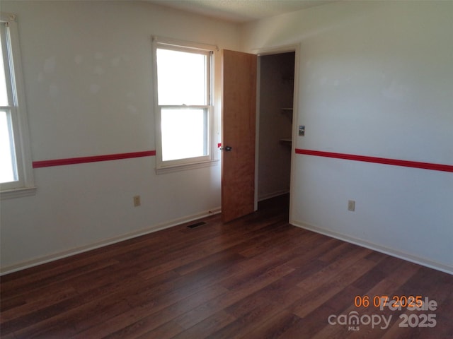 1203 Dudley Shoals Rd, Granite Falls, NC 28630 - unfurnished room featuring healthy amount of natural light, wood finished floors, and baseboards