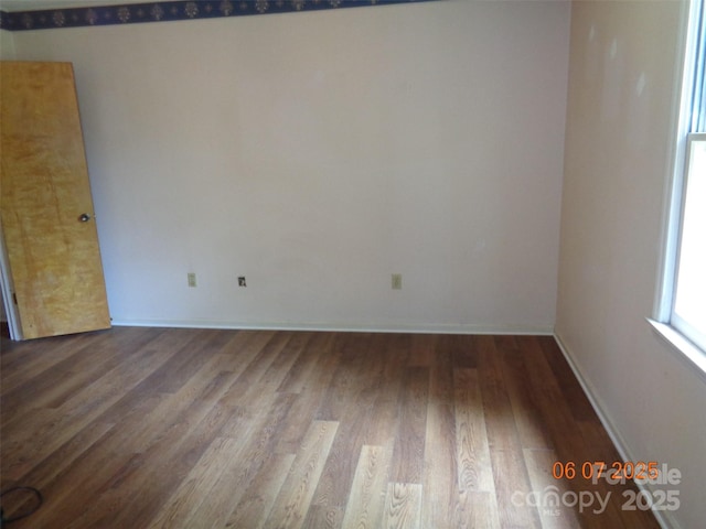 1203 Dudley Shoals Rd, Granite Falls, NC 28630 - empty room featuring wood finished floors and baseboards