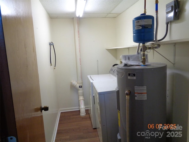 1203 Dudley Shoals Rd, Granite Falls, NC 28630 - washroom with water heater, independent washer and dryer, wood finished floors, and baseboards