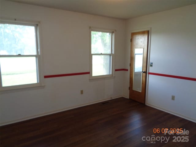 1203 Dudley Shoals Rd, Granite Falls, NC 28630 - empty room featuring wood finished floors and baseboards