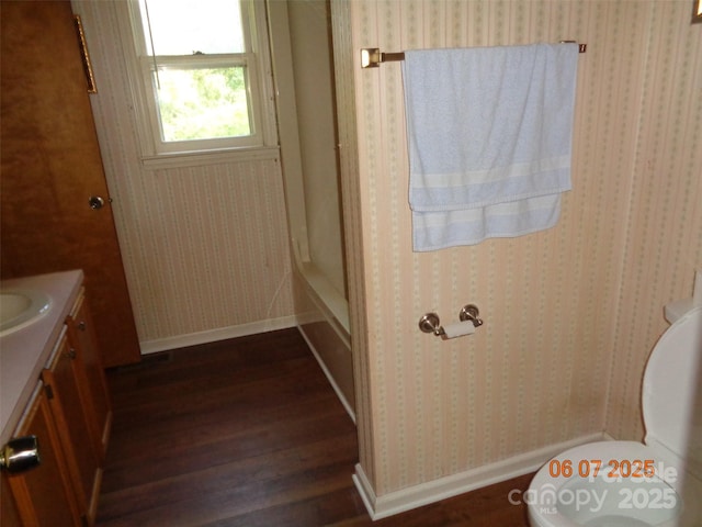 1203 Dudley Shoals Rd, Granite Falls, NC 28630 - bathroom with wood finished floors, vanity, baseboards, and toilet