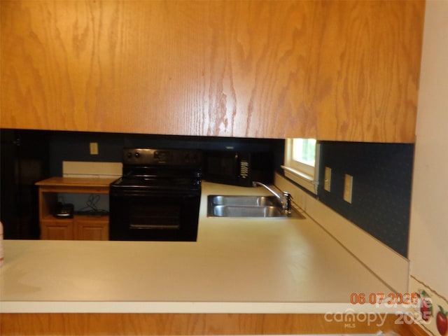 1203 Dudley Shoals Rd, Granite Falls, NC 28630 - kitchen featuring black appliances, a sink, and light countertops