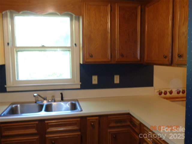 1203 Dudley Shoals Rd, Granite Falls, NC 28630 - kitchen featuring a sink, light countertops, and brown cabinets