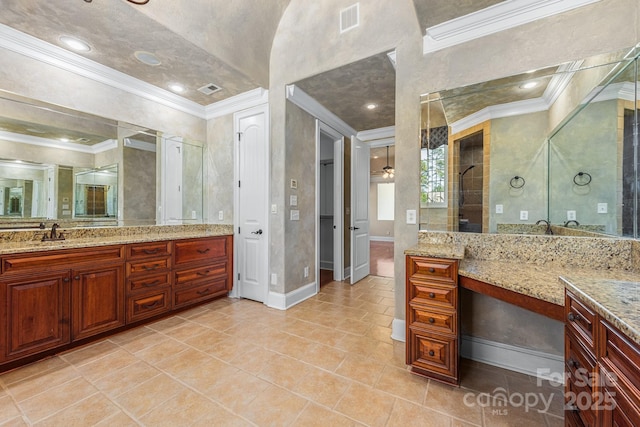 full bathroom featuring ornamental molding, tile patterned floors, baseboards, vanity, and a shower