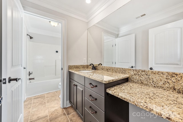 bathroom featuring vanity, bathtub / shower combination, toilet, and crown molding