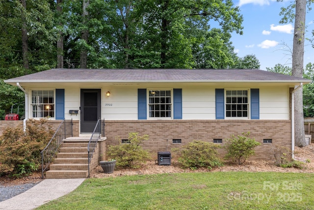 3900 Langley Rd, Charlotte, NC 28215 - ranch-style home featuring brick siding, a front yard, and crawl space