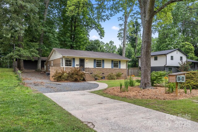 3900 Langley Rd, Charlotte, NC 28215 - ranch-style house with brick siding, driveway, and crawl space