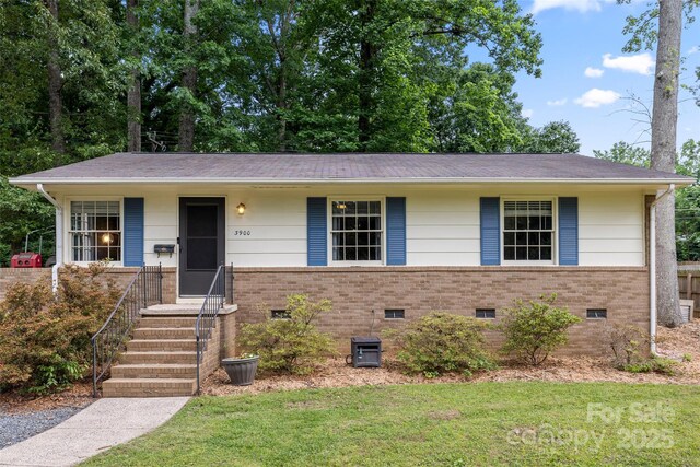 3900 Langley Rd, Charlotte, NC 28215 - ranch-style home featuring brick siding, a front yard, and crawl space