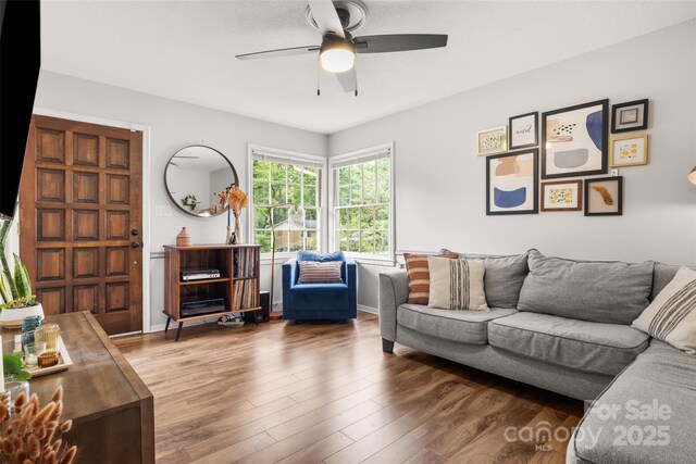 3900 Langley Rd, Charlotte, NC 28215 - living area featuring a ceiling fan, wood finished floors, and baseboards