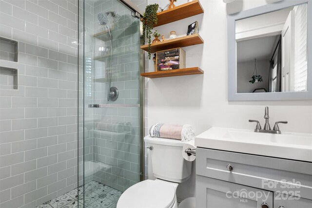 3900 Langley Rd, Charlotte, NC 28215 - bathroom featuring a shower stall, toilet, and vanity