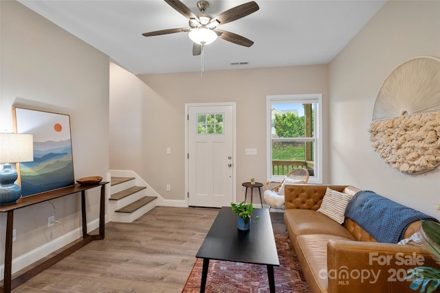 43 Clarks Chapel Ext, Weaverville, NC 28787 - living area featuring light wood finished floors, a ceiling fan, stairs, and baseboards