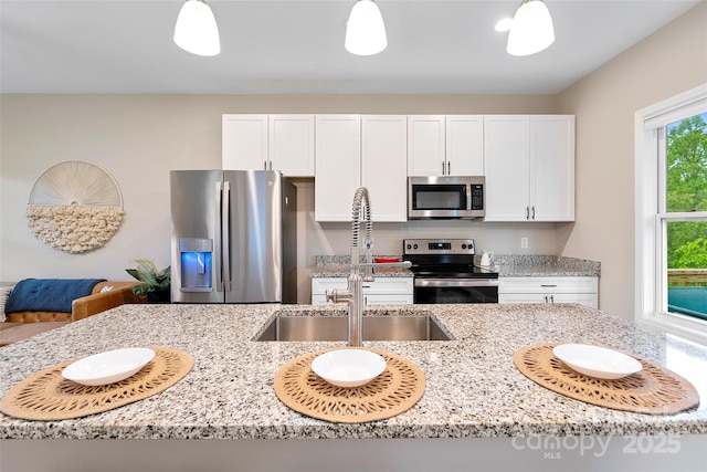 43 Clarks Chapel Ext, Weaverville, NC 28787 - kitchen with appliances with stainless steel finishes, a sink, white cabinets, and light stone countertops