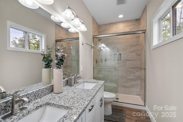43 Clarks Chapel Ext, Weaverville, NC 28787 - bathroom with toilet, a shower stall, wood finished floors, double vanity, and baseboards