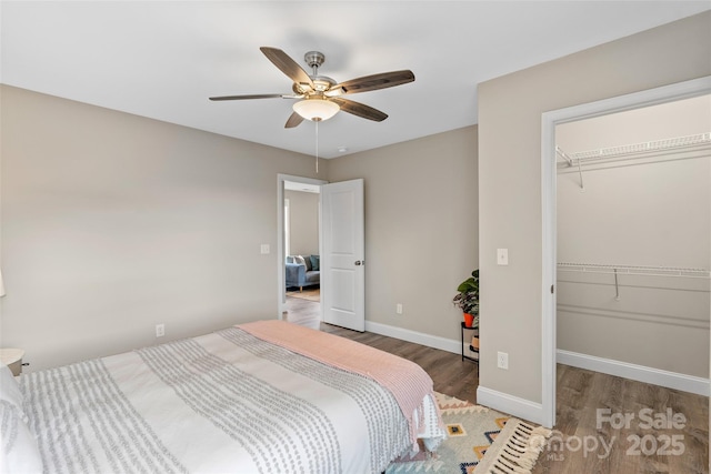 43 Clarks Chapel Ext, Weaverville, NC 28787 - bedroom with wood finished floors, a closet, baseboards, a walk in closet, and ceiling fan
