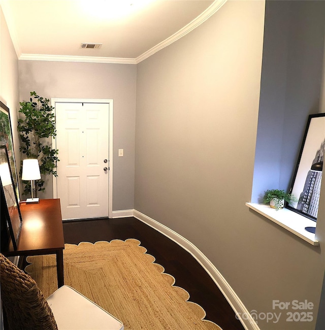 1000 E Woodlawn Rd Unit 107, Charlotte, NC 28209 - entrance foyer featuring ornamental molding, baseboards, and dark wood-type flooring