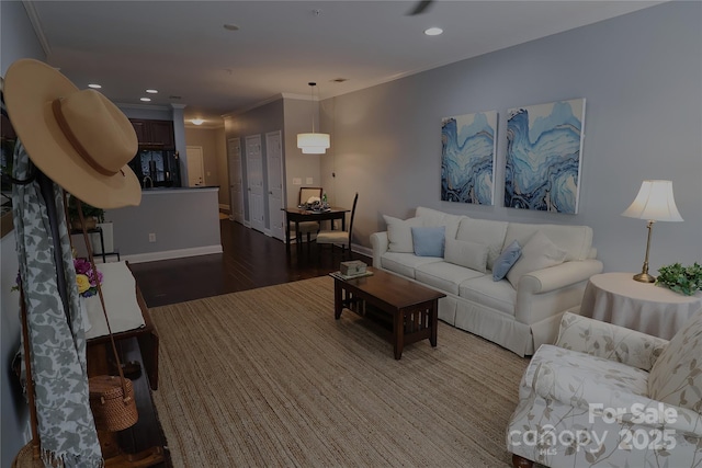 1000 E Woodlawn Rd Unit 107, Charlotte, NC 28209 - living room featuring wood finished floors, crown molding, recessed lighting, and baseboards