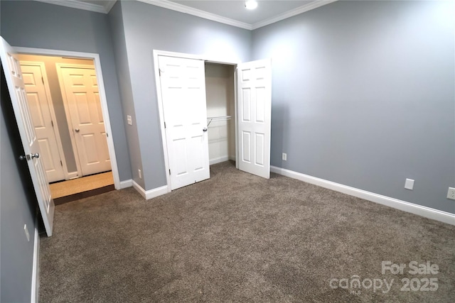 1000 E Woodlawn Rd Unit 107, Charlotte, NC 28209 - unfurnished bedroom featuring crown molding, dark carpet, baseboards, and a closet