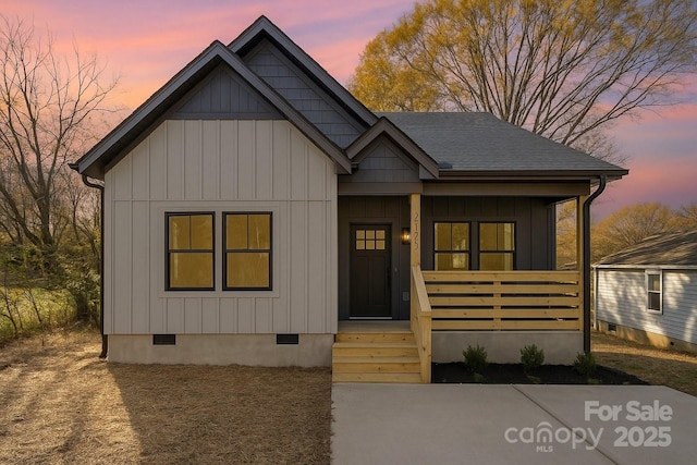 415 S Boyd St, Gastonia, NC 28052 - view of front of house featuring crawl space, covered porch, and board and batten siding
