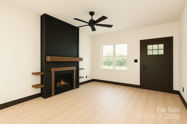 415 S Boyd St, Gastonia, NC 28052 - unfurnished living room featuring wood finished floors, baseboards, ceiling fan, and a fireplace