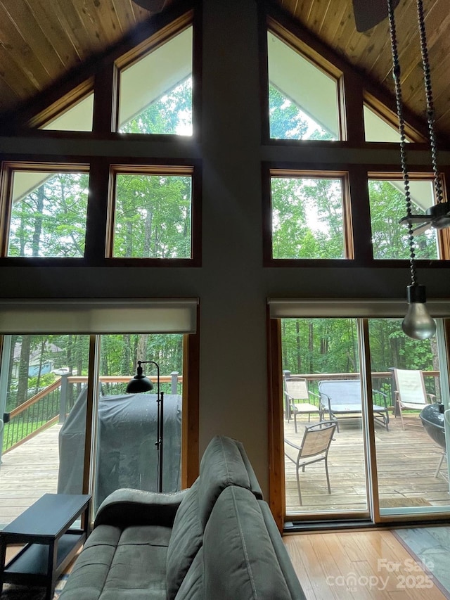 491 Mckenzie Way S, Old Fort, NC 28762 - living area featuring high vaulted ceiling, wooden ceiling, healthy amount of natural light, and wood finished floors
