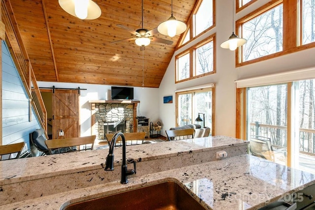 491 Mckenzie Way S, Old Fort, NC 28762 - kitchen with wooden ceiling, high vaulted ceiling, a ceiling fan, hanging light fixtures, and a barn door