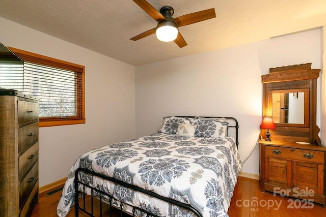 491 Mckenzie Way S, Old Fort, NC 28762 - bedroom with wood finished floors and ceiling fan