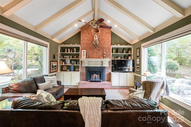 287 Anne St, Rutherfordton, NC 28139 - living room featuring ceiling fan, a brick fireplace, built in features, and wood finished floors