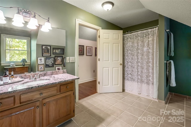 287 Anne St, Rutherfordton, NC 28139 - full bathroom with a textured ceiling, tile patterned floors, vanity, and a shower with shower curtain