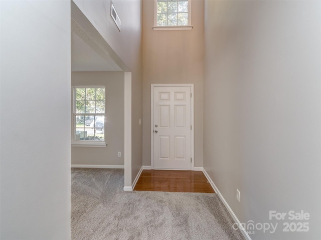 4208 Everest Dr, Gastonia, NC 28054 - foyer entrance with carpet floors, a towering ceiling, and baseboards