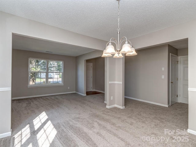 4208 Everest Dr, Gastonia, NC 28054 - spare room featuring a chandelier, carpet flooring, a textured ceiling, and baseboards