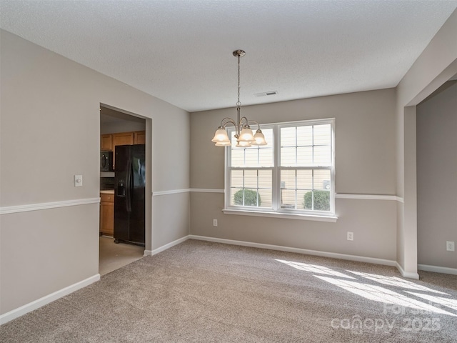 4208 Everest Dr, Gastonia, NC 28054 - empty room featuring a chandelier, light carpet, and baseboards