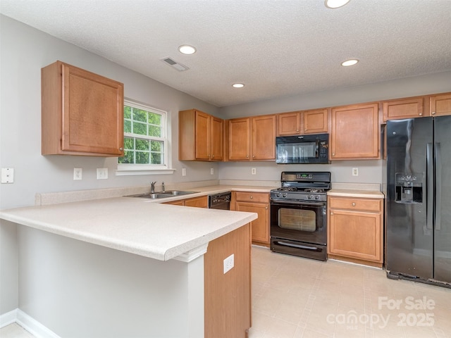 4208 Everest Dr, Gastonia, NC 28054 - kitchen featuring black appliances, a sink, a peninsula, recessed lighting, and light countertops