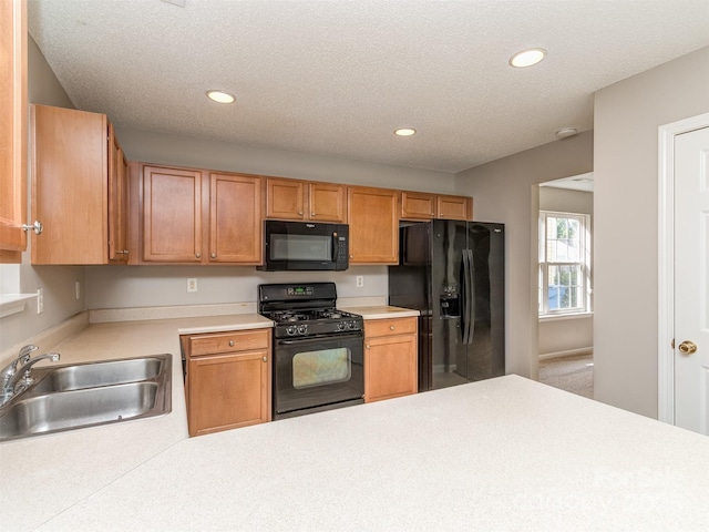 4208 Everest Dr, Gastonia, NC 28054 - kitchen with black appliances, a sink, light countertops, recessed lighting, and a textured ceiling