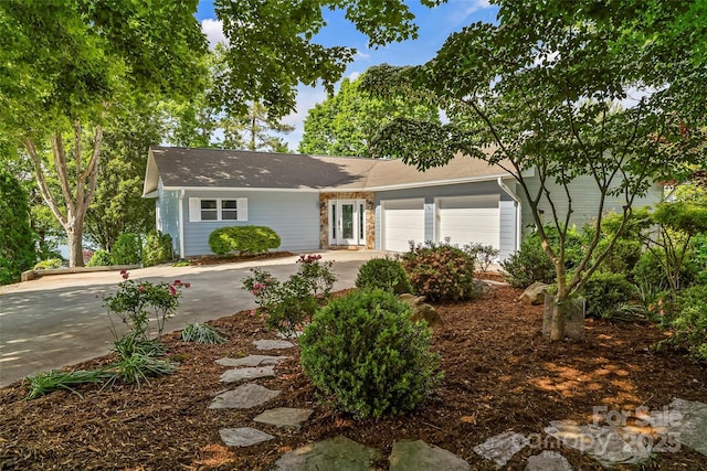2218 Mallard Cove Dr, Nebo, NC 28761 - view of front of property with an attached garage, concrete driveway, and stone siding
