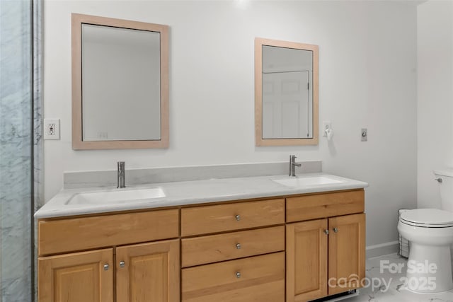 2218 Mallard Cove Dr, Nebo, NC 28761 - full bathroom featuring toilet, double vanity, and baseboards